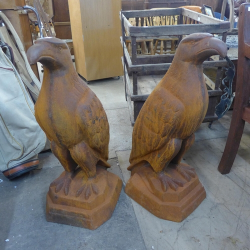 295 - A pair of large cast iron garden figures of eagles