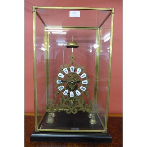 359 - A cased brass fusee skeleton clock