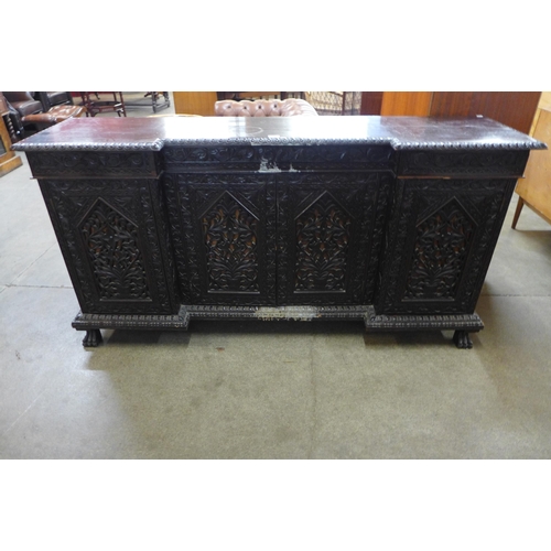 36 - A 19th Century Anglo-Indian carved hardwood breakfront sideboard