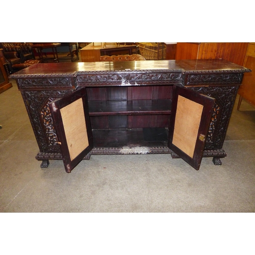 36 - A 19th Century Anglo-Indian carved hardwood breakfront sideboard