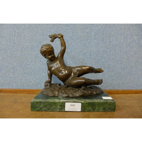 368 - A French style bronze figure of a cherub, on green marble socle