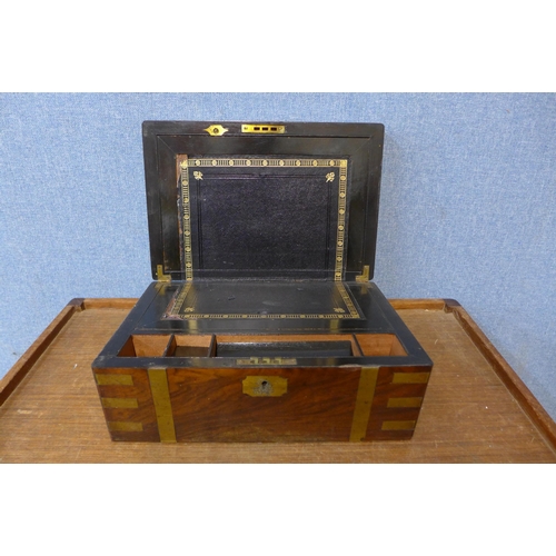 373 - A Victorian walnut and brass inlaid writing slope