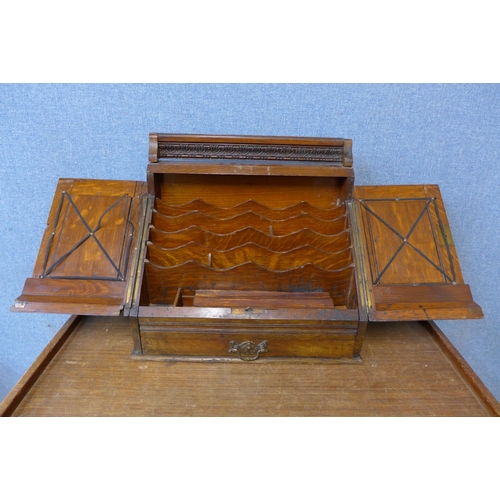 374 - A Victorian Aesthetic Movement carved oak letter and stationery cabinet