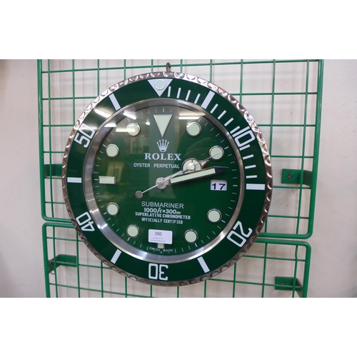 380 - A Rolex style dealer's circular wall clock