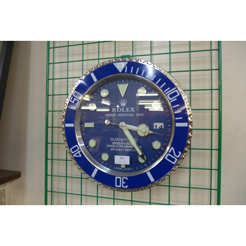 381 - A Rolex style dealer's circular wall clock