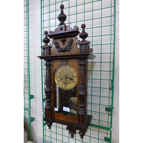 383 - A 19th Century walnut Vienna wall clock