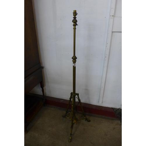 39 - An Arts and Crafts brass and copper floor standing lamp