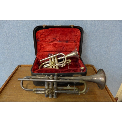 407 - A cased cornet and a trumpet (lacking mouthpiece)