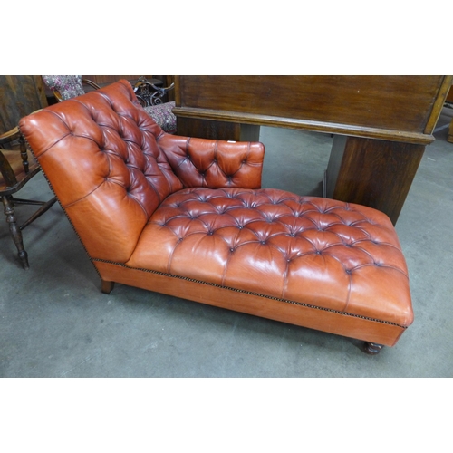 47 - A Chesterfield red leather chaise longue