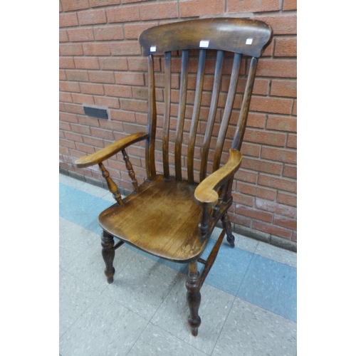 6 - A Victorian beech farmhouse armchair