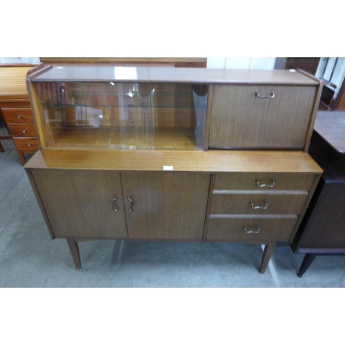 62 - A Nathan tola wood highboard