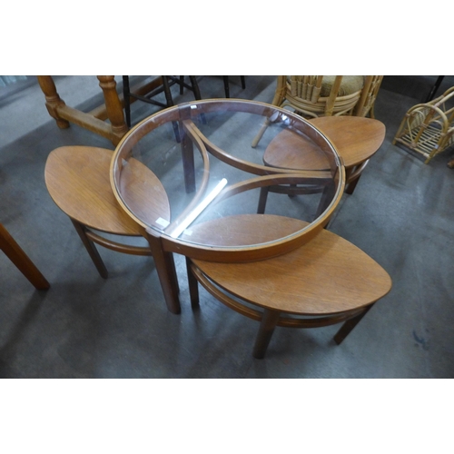 68 - A Nathan teak and glass topped circular nest of tables