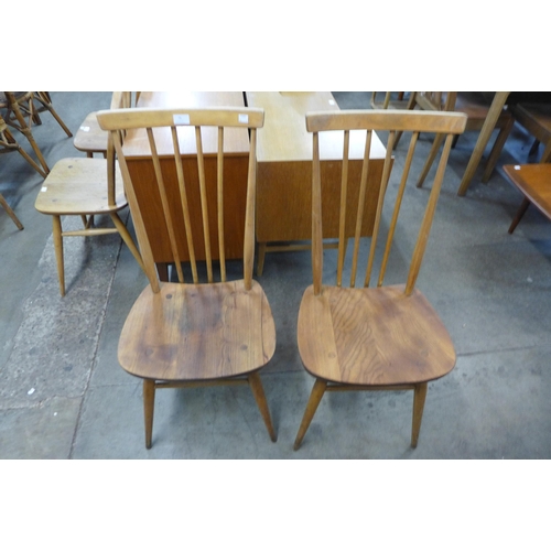 75 - A pair of Ercol Blonde elm and beech chairs