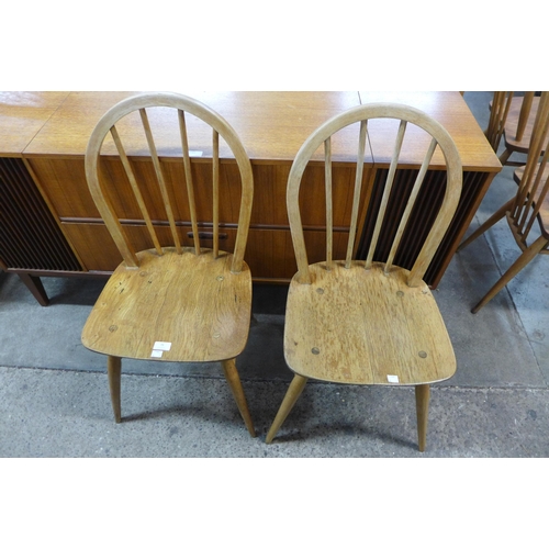 76 - A pair of Ercol Blonde elm and beech chairs