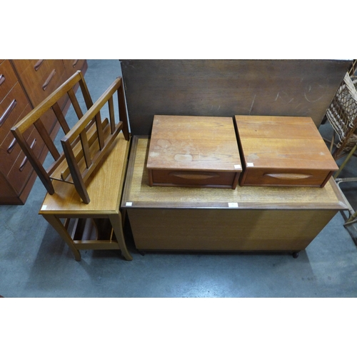 91 - A teak blanket box, two magazine racks, etc.