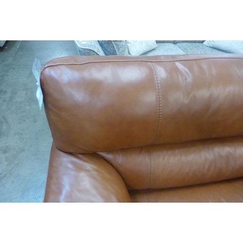 1301 - A designer tan leather three seater sofa and footstool/ottoman