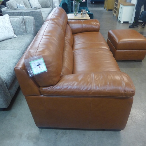 1301 - A designer tan leather three seater sofa and footstool/ottoman