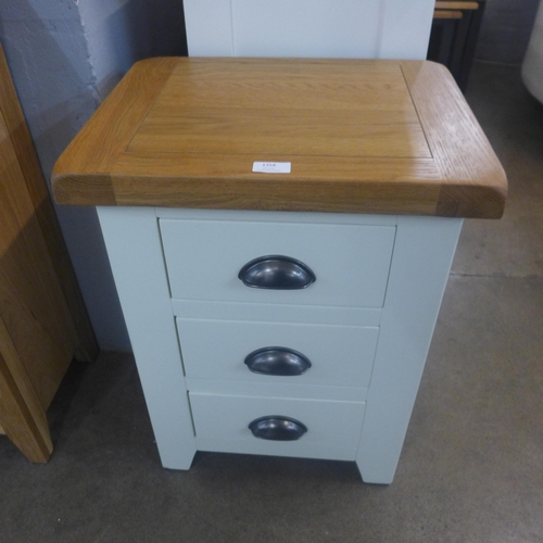 1358 - A cream painted and oak three drawer chest *This lot is subject to VAT