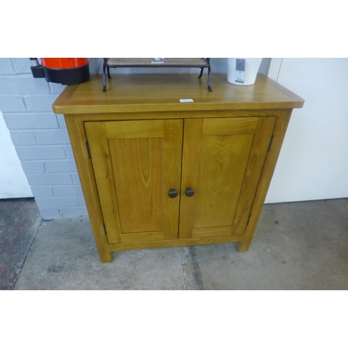 1363 - An oak two door cabinet *This lot is subject to VAT