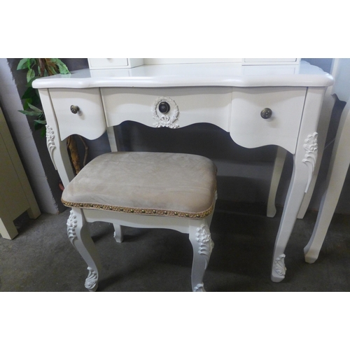 1398 - A white antique style dressing table with upholstered stool and mirror (marked)