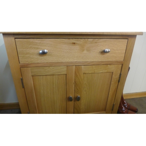 1407 - An oak two door cabinet *This lot is subject to VAT