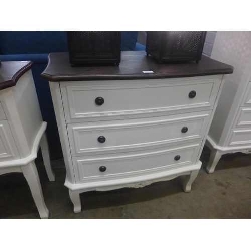 1374 - A white three drawer chest with contrasting top (marked)