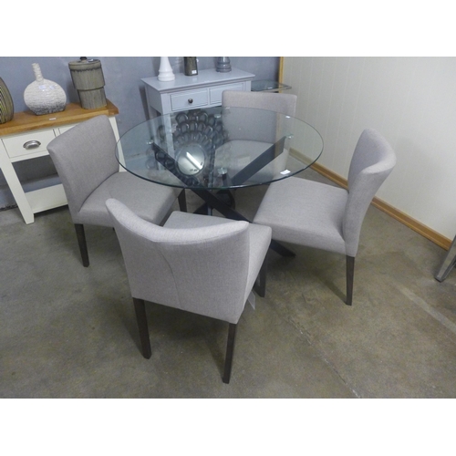 1430 - A circular glass and black metal base dining table with a set of four grey fabric chairs