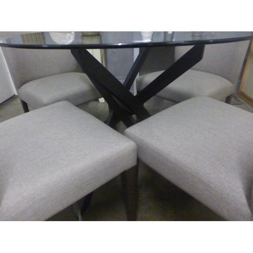 1430 - A circular glass and black metal base dining table with a set of four grey fabric chairs