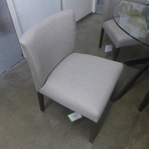 1430 - A circular glass and black metal base dining table with a set of four grey fabric chairs