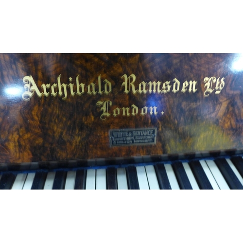 2123 - An early 20th Century burr walnut cased upright piano by Archibald Ramsden Ltd., London