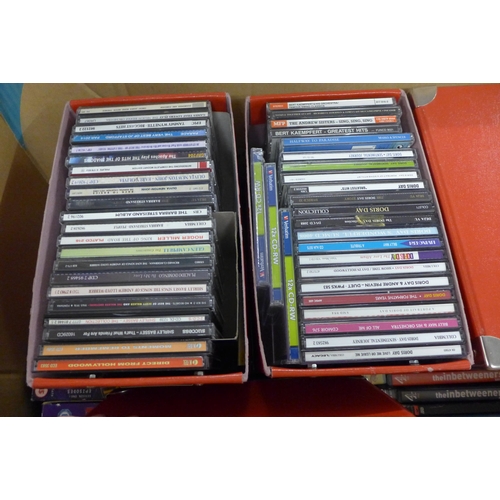 2156 - Approx. 500 DVD's & 50 CD's in shelf boxes