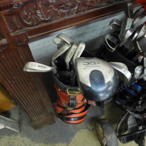 2382 - Six golf bags, two trolleys plus 40-50 golf clubs