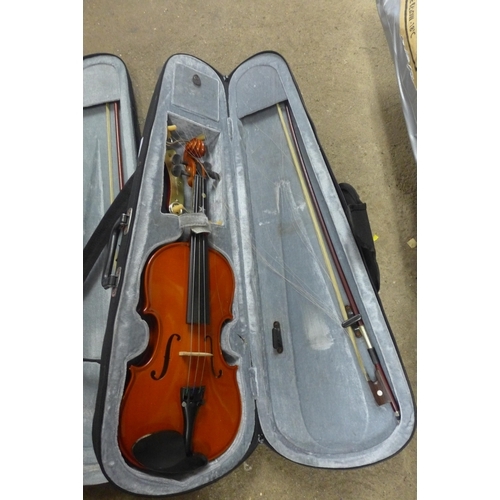 2250 - 2 Violins, one pink, one wood with bows & cases