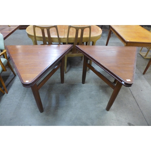 93 - A pair of teak triangular side tables