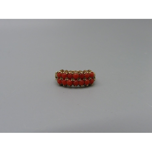 1082 - A 9ct gold, fourteen stone, two row coral ring, 2g, P