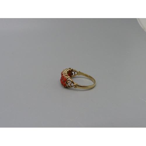 1082 - A 9ct gold, fourteen stone, two row coral ring, 2g, P