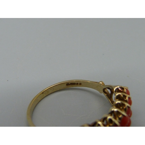 1082 - A 9ct gold, fourteen stone, two row coral ring, 2g, P