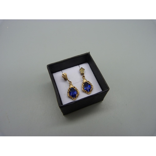 1083 - A pair of 9ct gold and blue stone earrings, 2.7g