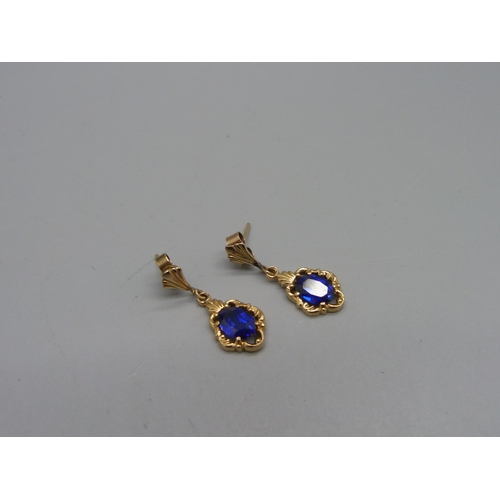 1083 - A pair of 9ct gold and blue stone earrings, 2.7g