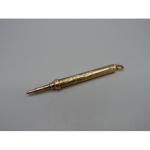 1084 - A yellow metal pencil, mark worn