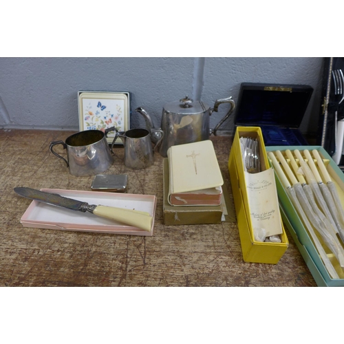 1087 - A collection of flatware, a three piece plated tea service, a jewellery box, a prayer book, etc. **P... 