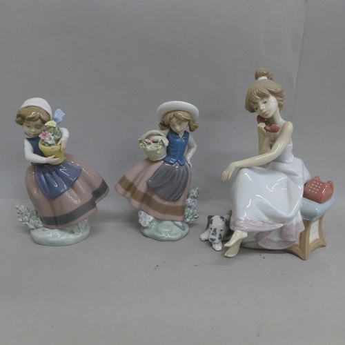 614 - Three Lladro figures, including girl on telephone