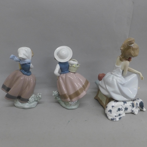 614 - Three Lladro figures, including girl on telephone