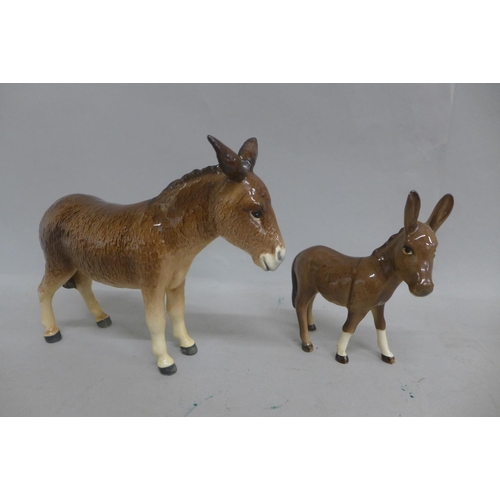 631 - A Beswick donkey and foal