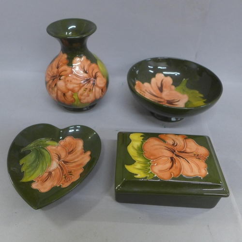 656 - Four pieces of Green Hibiscus Moorcroft; vase, lidded box, dish and bowl