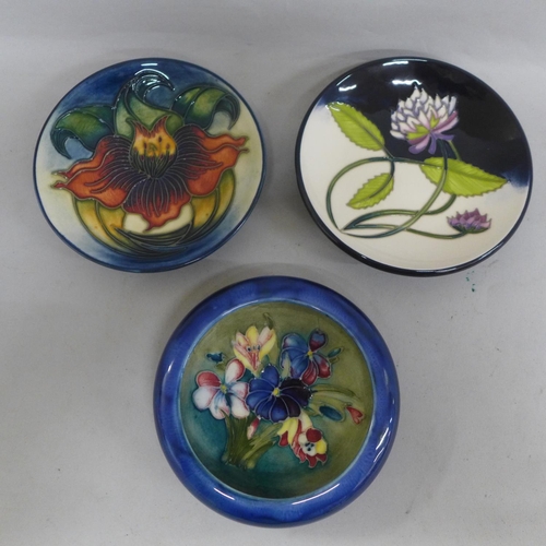 667 - A Moorcroft Spring Flower bowl and two pin dishes; Anna Lily and Trefoil