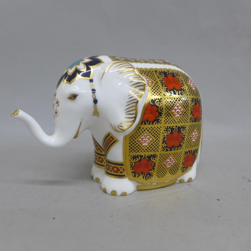 670 - A Royal Crown Derby paperweight - Elephant, 1128 pattern, trunk raised, missing stopper