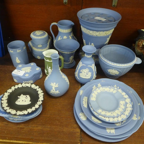 714 - A collection of Wedgwood Jasperware including a large posy vase, jug, vases, pin dishes, plates, etc... 