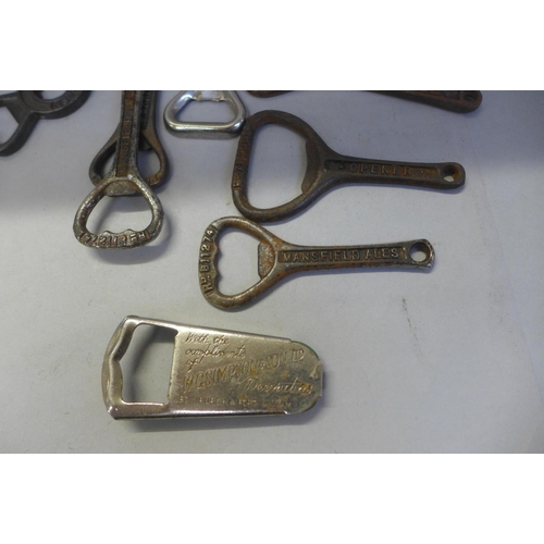 742 - Approximately fifty vintage advertising bottle openers