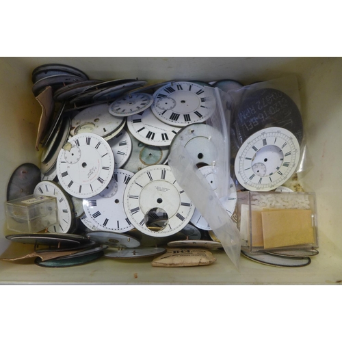 743 - A tub of enamel pocket watch dials